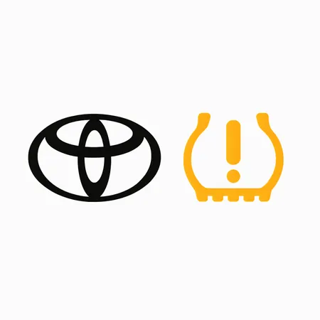Sigla Toyota si martorul TPMS galben pe fundal alb